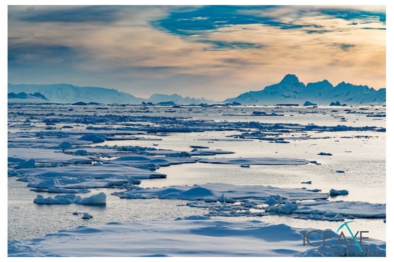 mountain landscape on the antarctic peninsula, ice blocks all over
